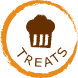 round ligth brown circle jaggered edge with the word treats and muffin centered